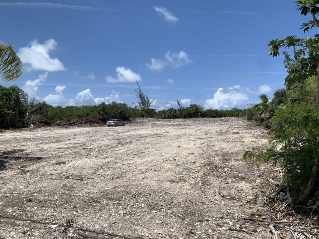 Cleared lot in Abaco before construction showing early stage of building process
